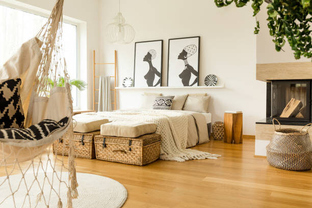 Boho-inspired living space with console table, decorative vases, and layered neutral flooring.